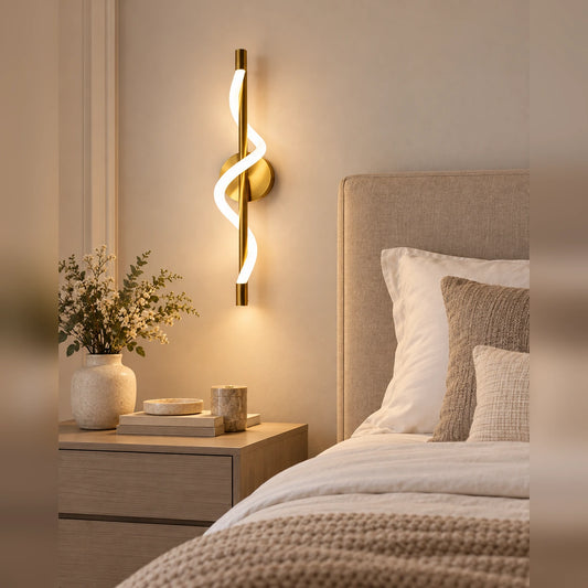 Twisted ribbon linear wall light beside a bed