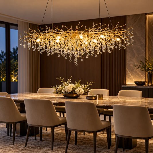 Gold clear crystal branch linear chandelier above a dining table