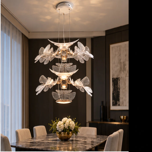 Clear botanical chandelier above a dining table