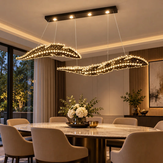 Twin-wave crystal chandelier above a dining table