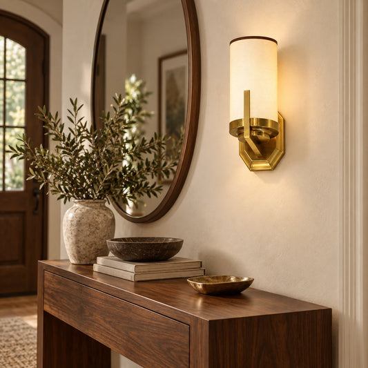 Cylinder shade wall sconce in a warm entryway