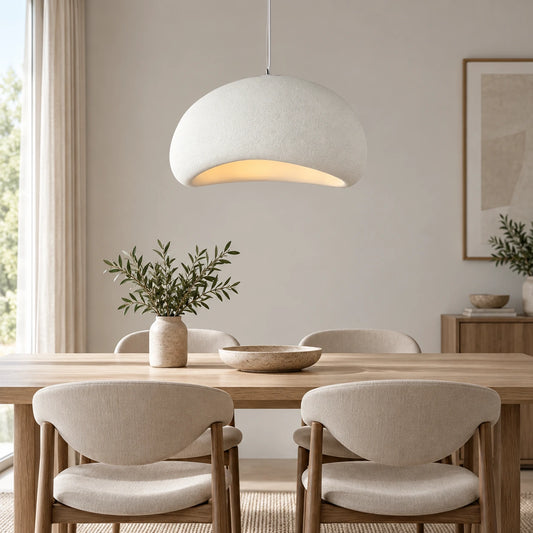 White textured curved dome pendant in a refined dining setting