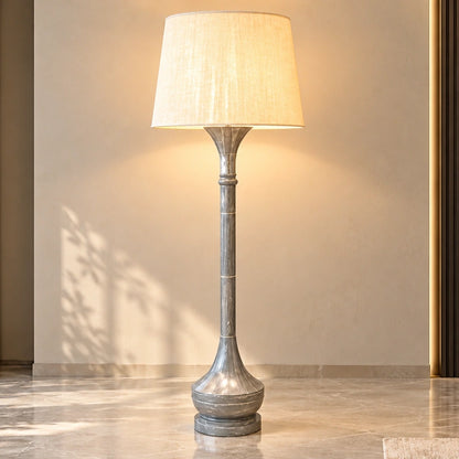 Grey marble-effect column floor lamp illuminated in a contemporary living room