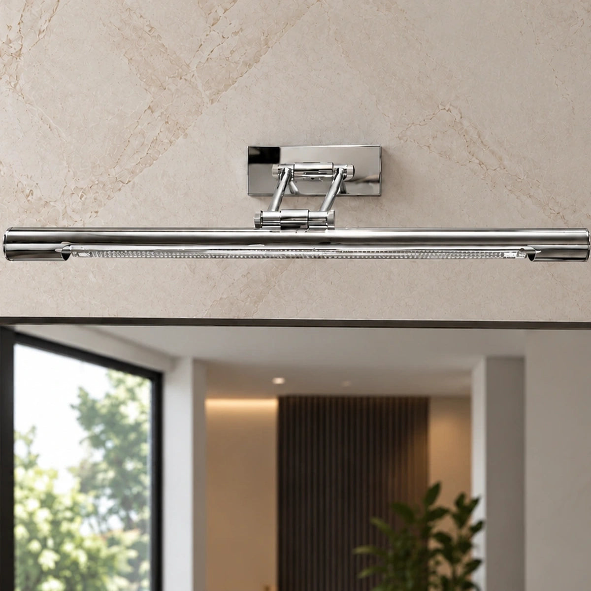 Chrome mirror light above a contemporary mirror