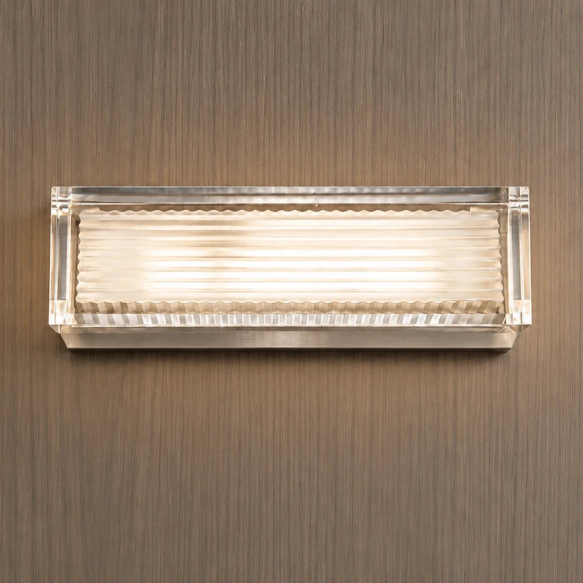Clear-frame ribbed wall light on a wood wall