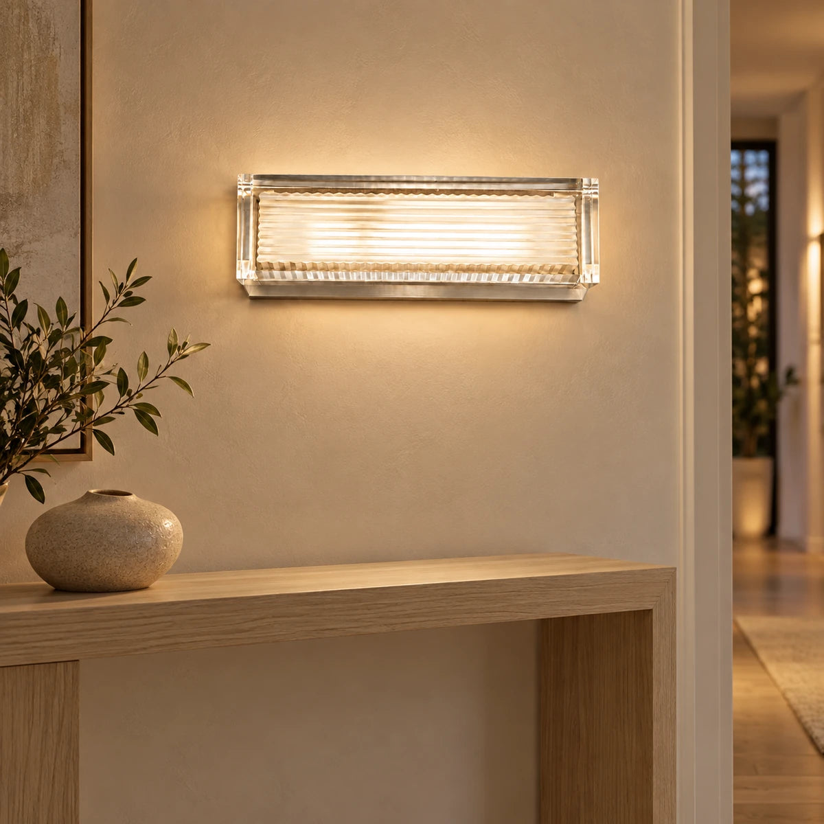 Clear-frame ribbed wall light in a hallway