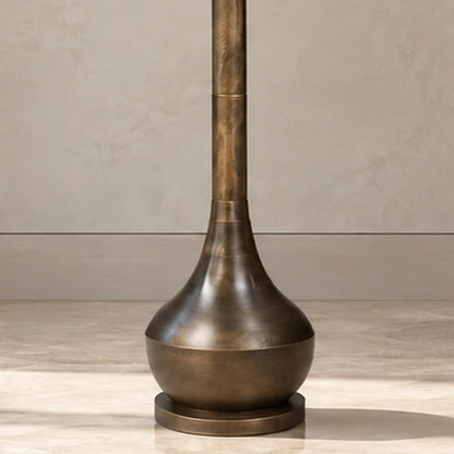 Close-up of the flared antique-bronze lower body and stepped round foot