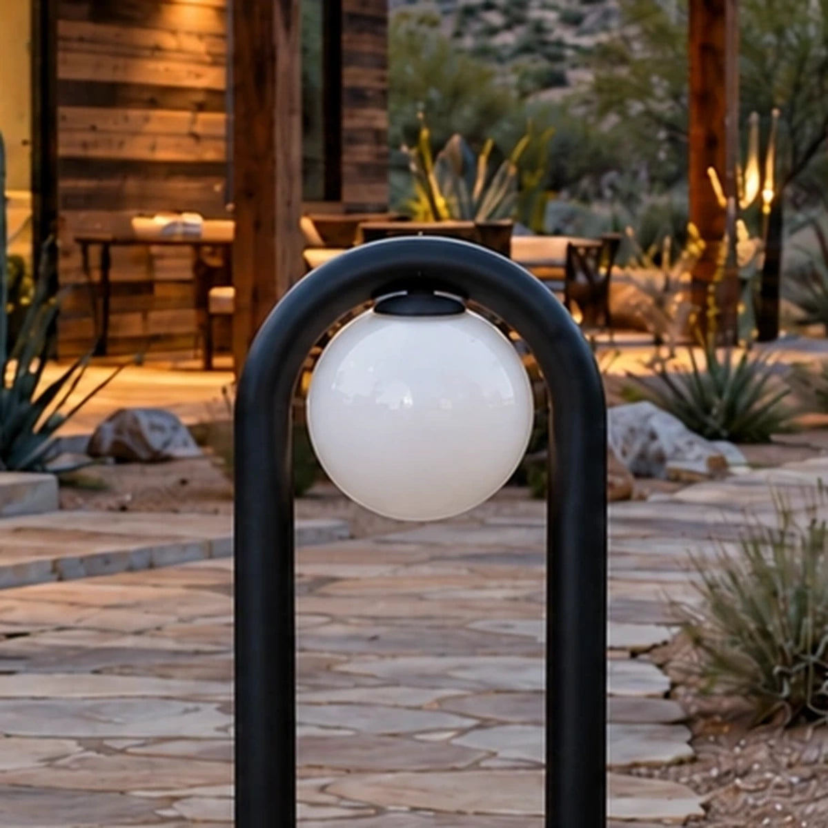 Close-up of the inverted U-shaped arch and white spherical diffuser