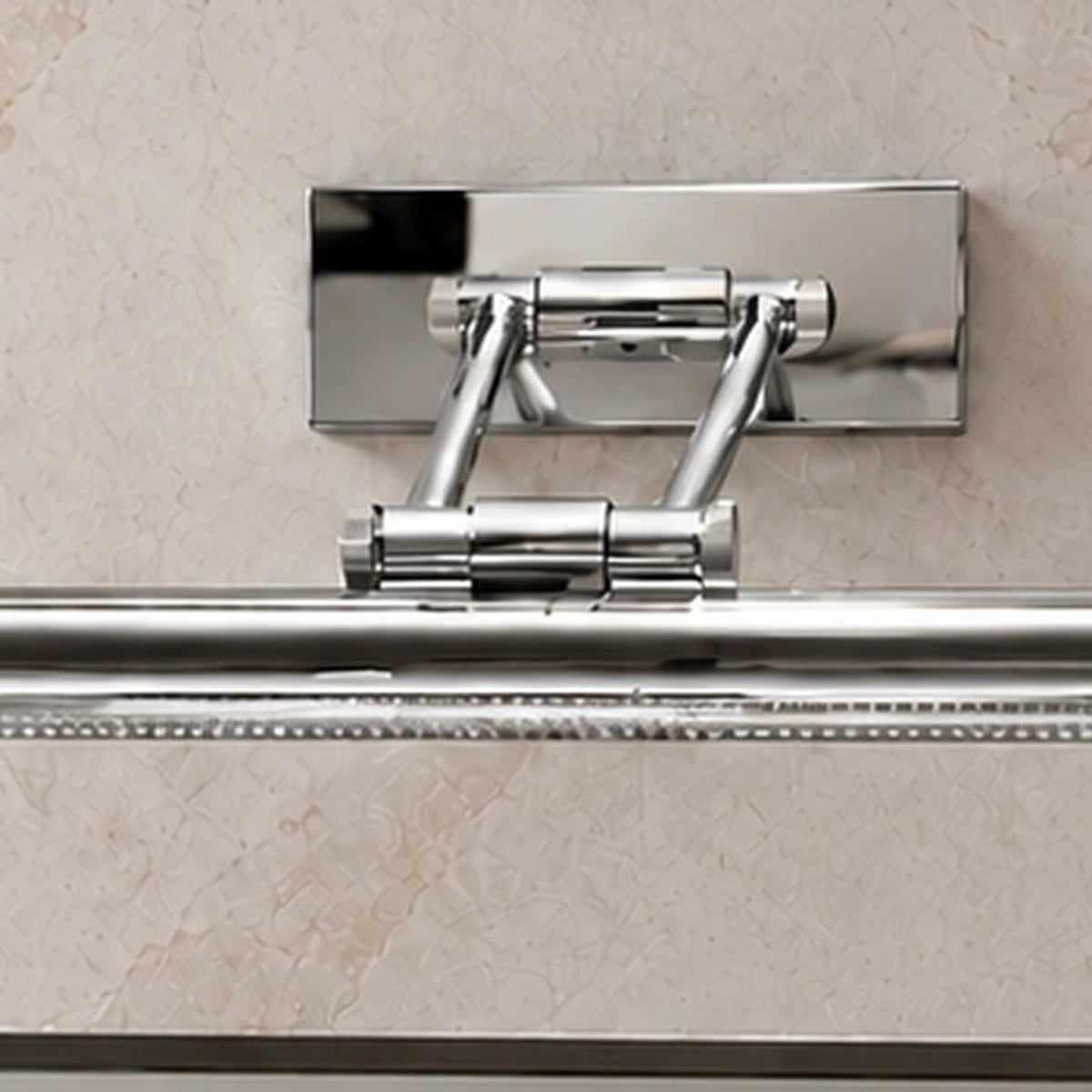 Close-up of the dual-arm chrome mounting assembly