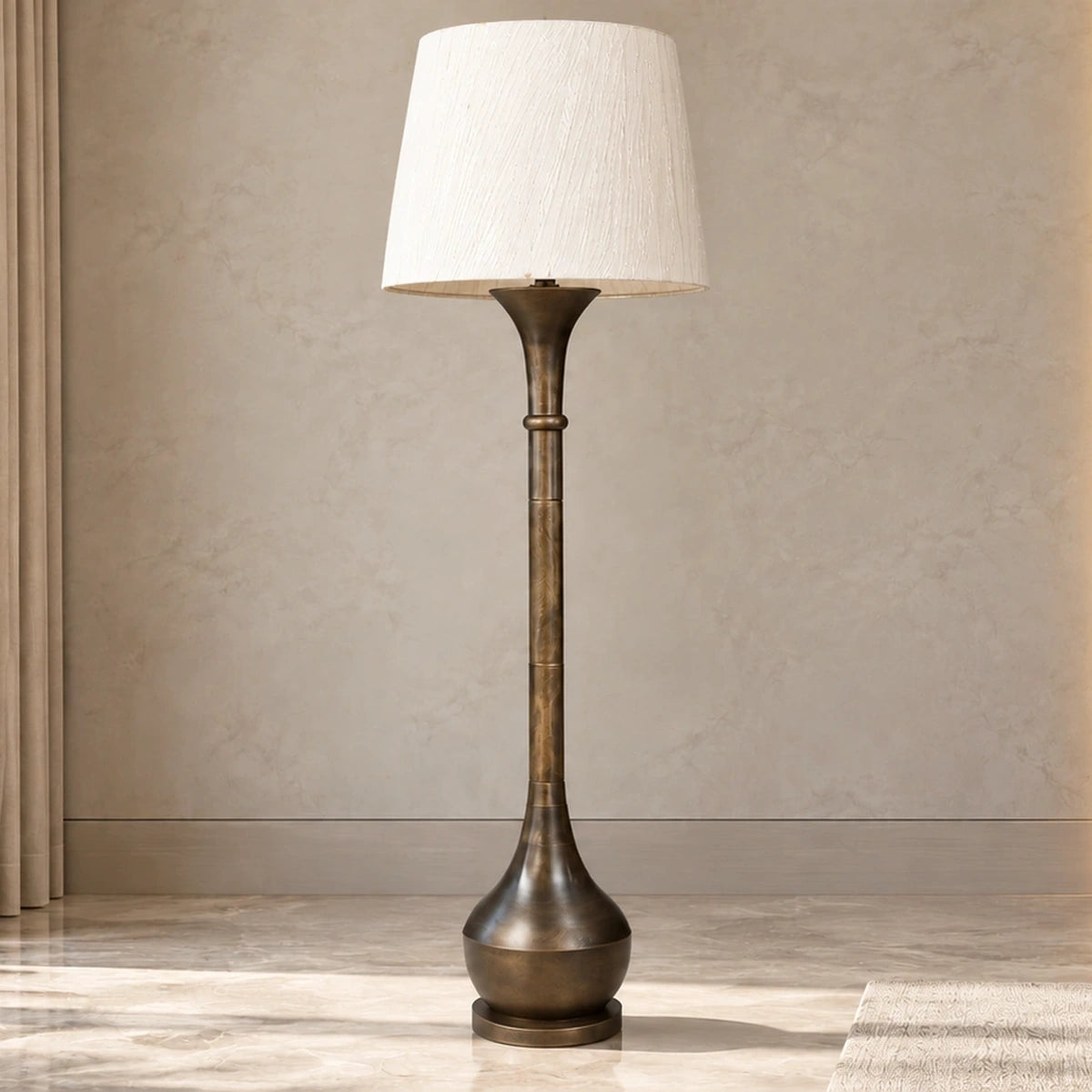 Antique-bronze column floor lamp unlit in a bright living-room setting