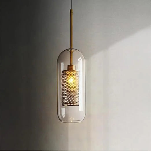 Single luxe capsule mesh pendant in a warm room setting