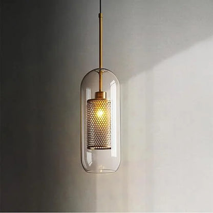 Single luxe capsule mesh pendant in a warm room setting