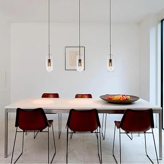 Luxe capsule mesh pendants above a dining table