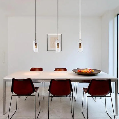 Luxe capsule mesh pendants above a dining table