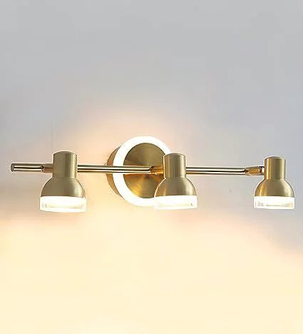 Golden triple-head vanity light illuminated front view
