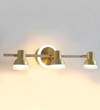 Golden triple-head vanity light illuminated front view