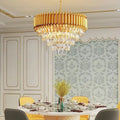 Golden Glow circular crystal chandelier above a dining table