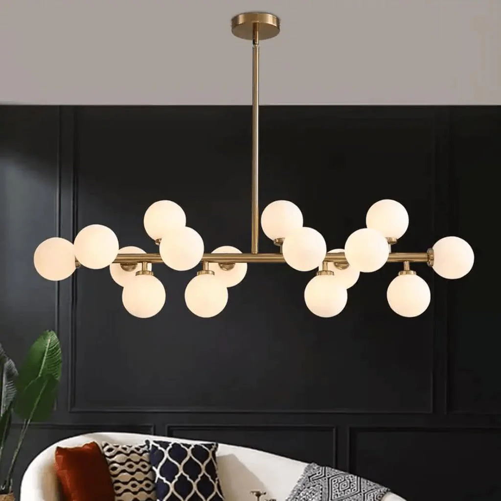 Opulent Glow sixteen-globe chandelier against a dark wall