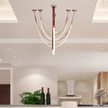 Buckle-Up strap chandelier over a contemporary dining area