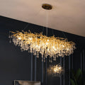 Golden tree branch crystal chandelier angled room view
