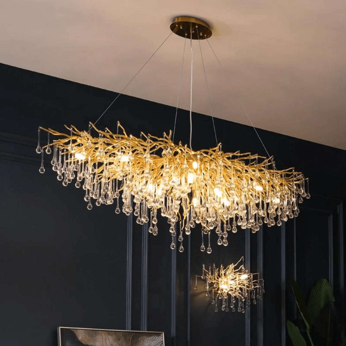 Golden tree branch crystal chandelier angled room view