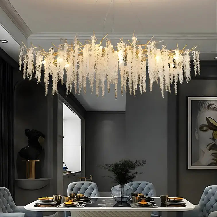 Grand cascade crystal chandelier above a dining table