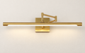 Gold picture light with source-matched open-V bracket — edited product image