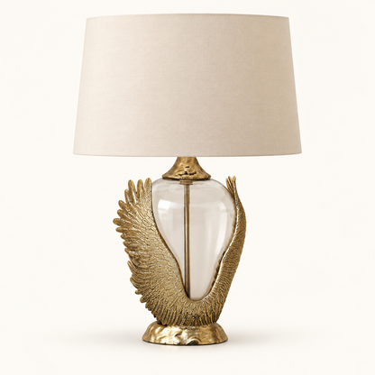Wing-design table lamp with beige fabric shade and clear glass centre