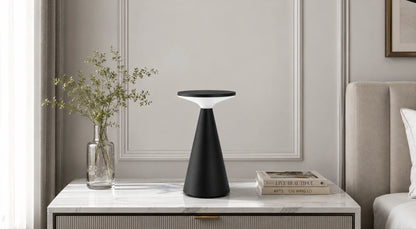 Supplier-provided bedside styling view of the black rechargeable disc lamp