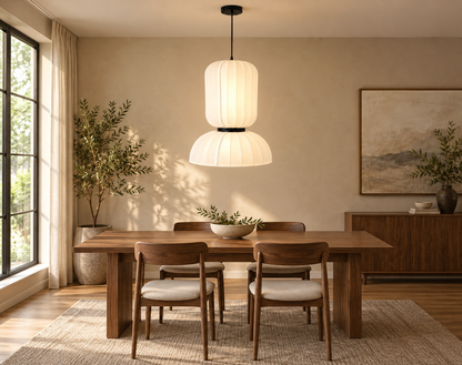 White cylinder and dome pendant above a walnut dining table