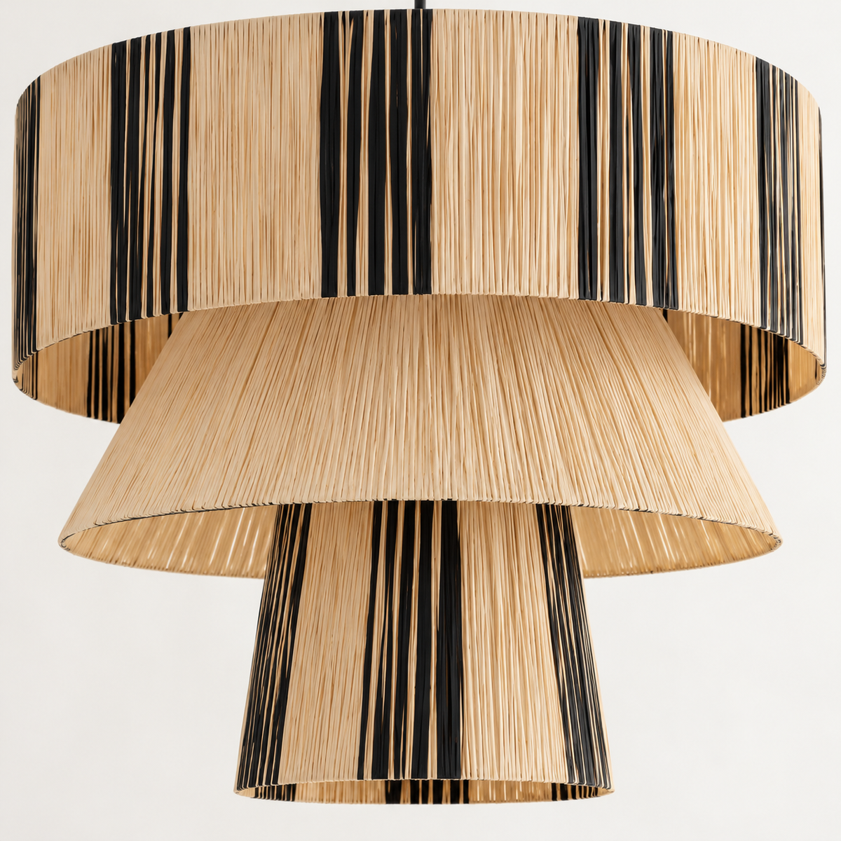 Layered woven shades with vertical black stripe groups
