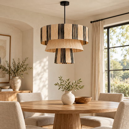 Three-tier striped pendant over a round dining table
