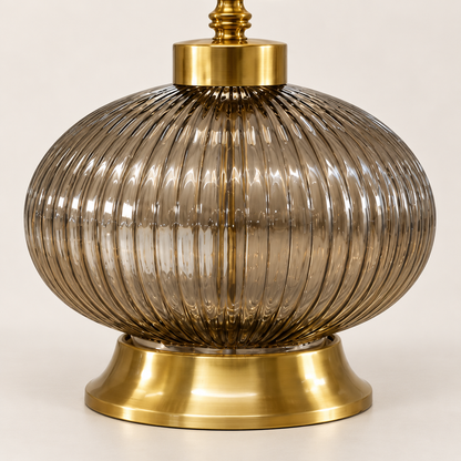 Detail of smoke ribbed-glass globe and gold-finish pedestal