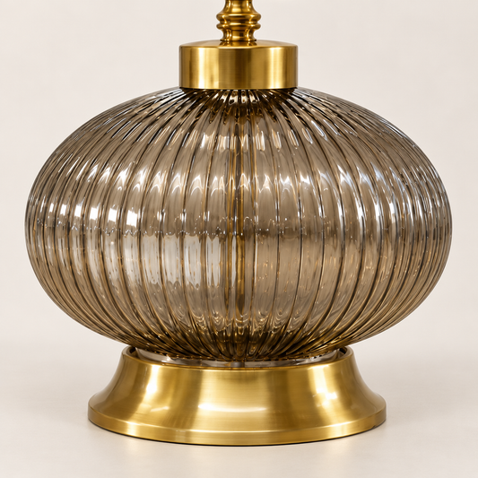 Detail of smoke ribbed-glass globe and gold-finish pedestal