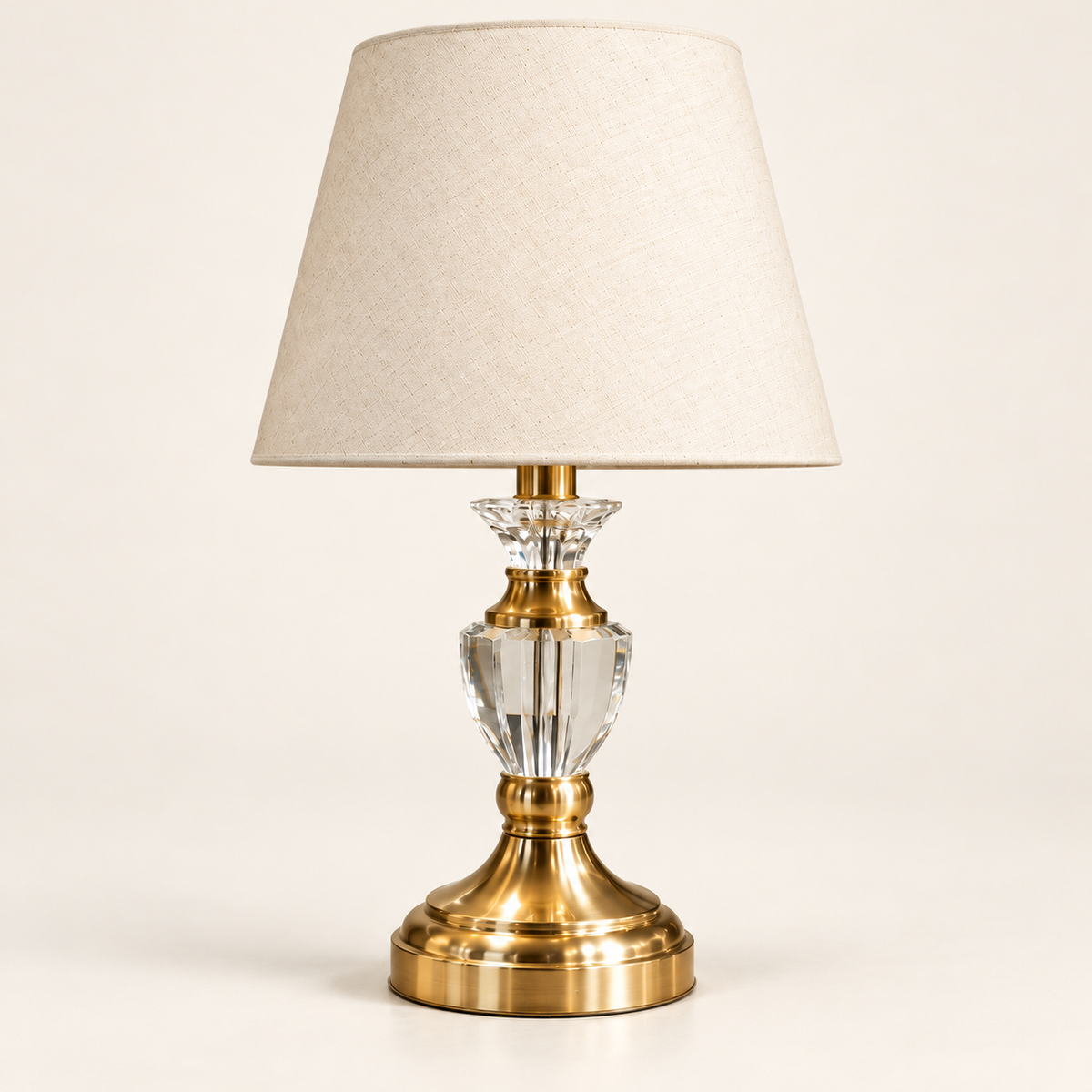 Faceted clear crystal urn table lamp with cream shade and gold-finish pedestal
