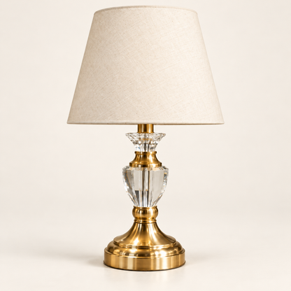 Faceted clear crystal urn table lamp with cream shade and gold-finish pedestal