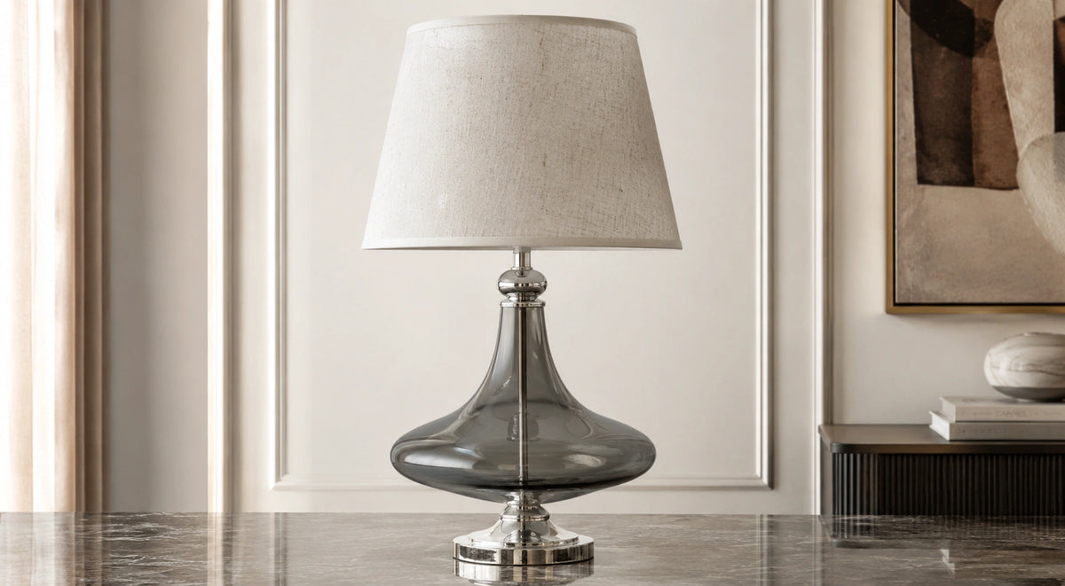 Supplier-provided room styling of the sculpted smoke glass table lamp