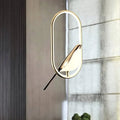 Bird in oval ring pendant installed close room view