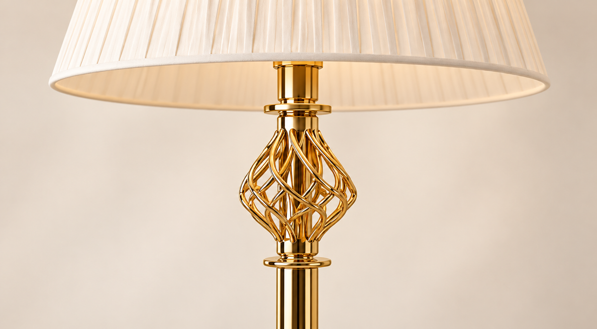 Close view of the Seraphine floor lamp gold-tone lattice detail and pleated shade