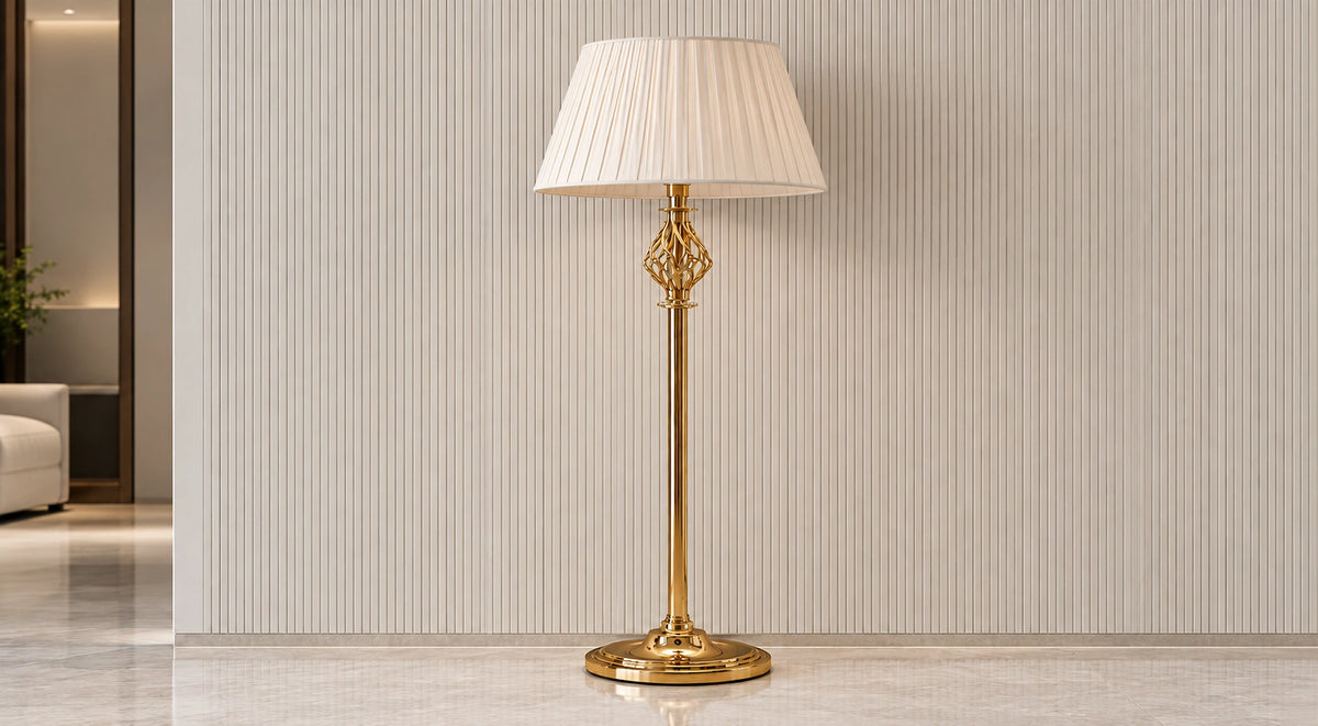 Seraphine gold-tone floor lamp switched off in a neutral interior