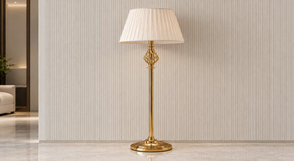 Seraphine gold-tone floor lamp switched off in a neutral interior