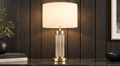 Aurelia crystal-rod table lamp illuminated on a dark console