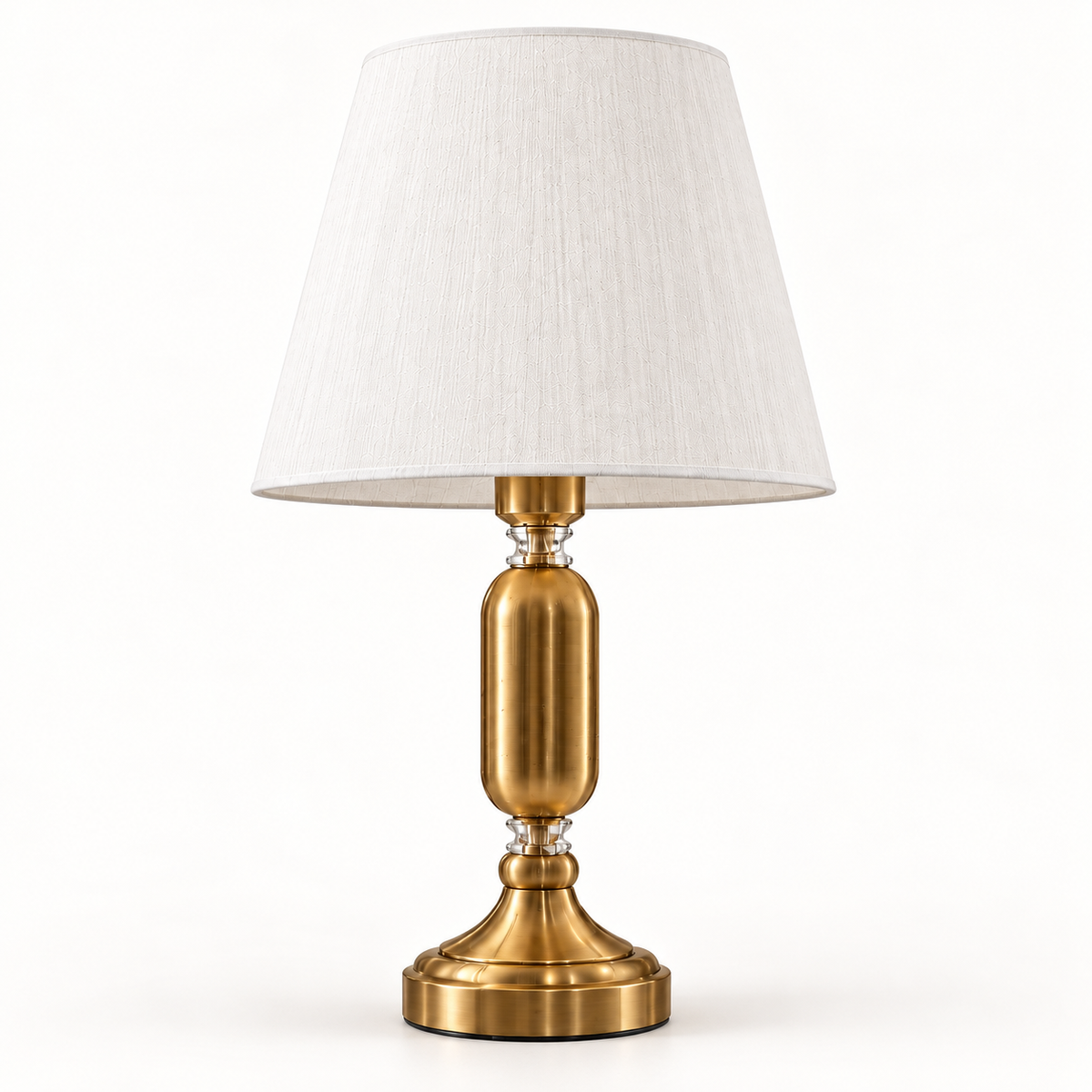 Elara brass-tone table lamp with white tapered shade on a warm-white background