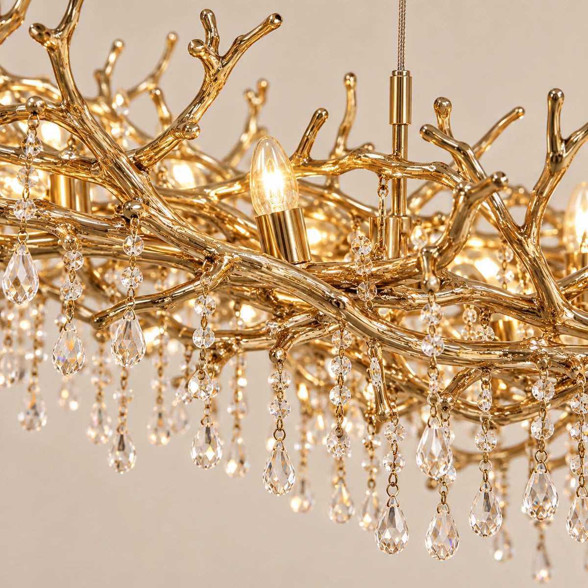 Close-up of gold twig branches with small clear crystal beads and teardrops
