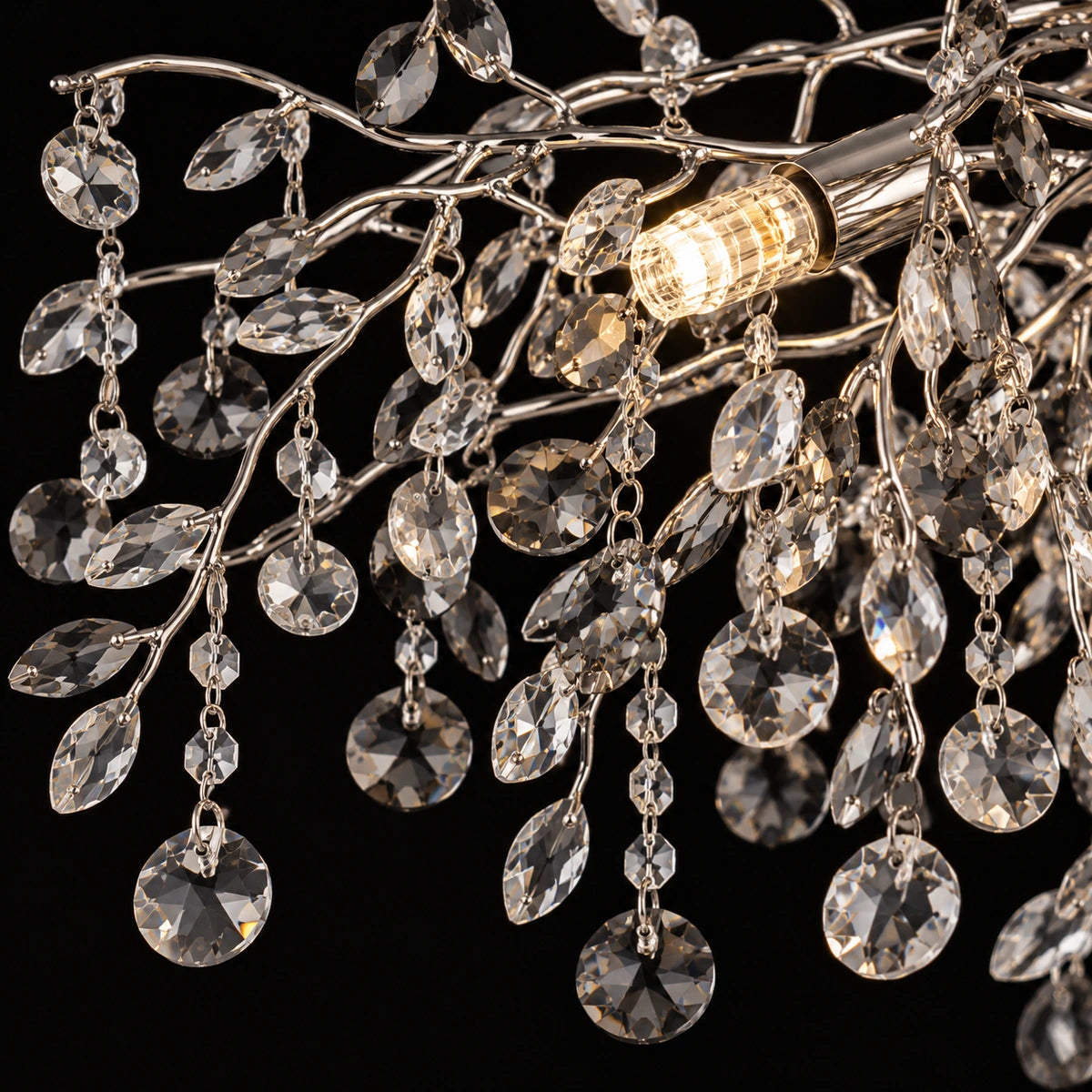 Close-up of silver branches, clear and smoke crystal leaves and droplets