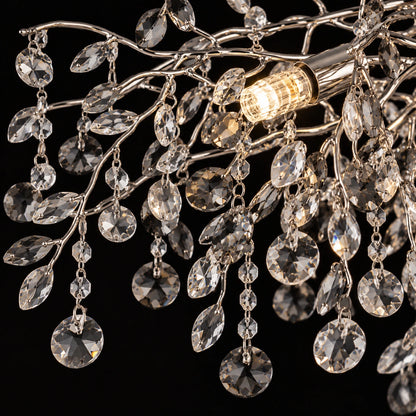 Close-up of silver branches, clear and smoke crystal leaves and droplets