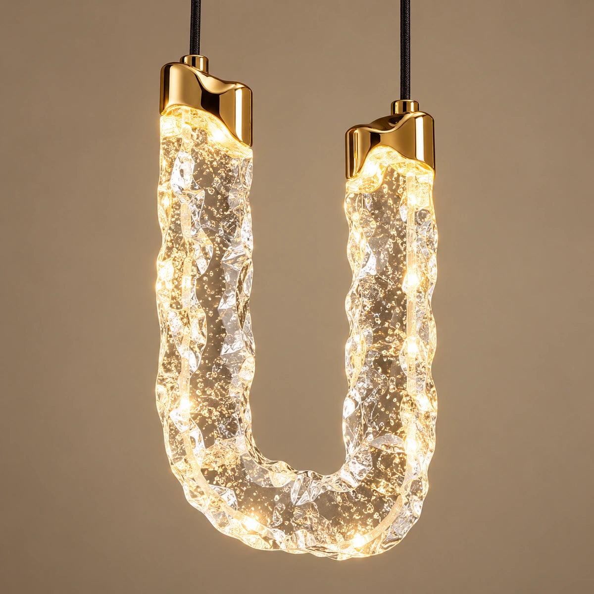 Close-up of one textured acrylic U-loop and gold caps