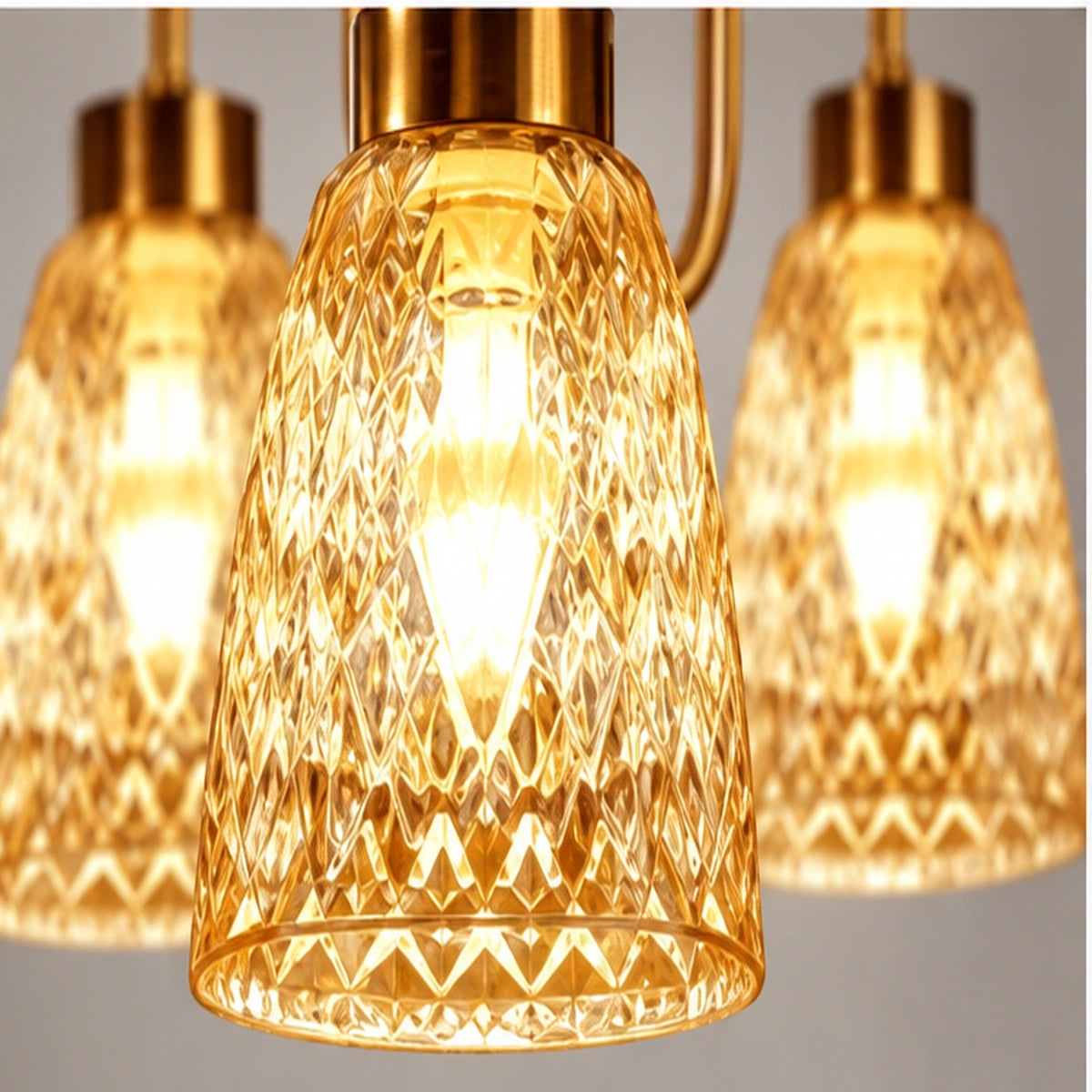 Close-up of patterned amber bell shade and gold holder