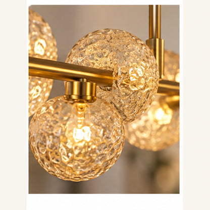 Close-up of textured amber glass globe and gold frame