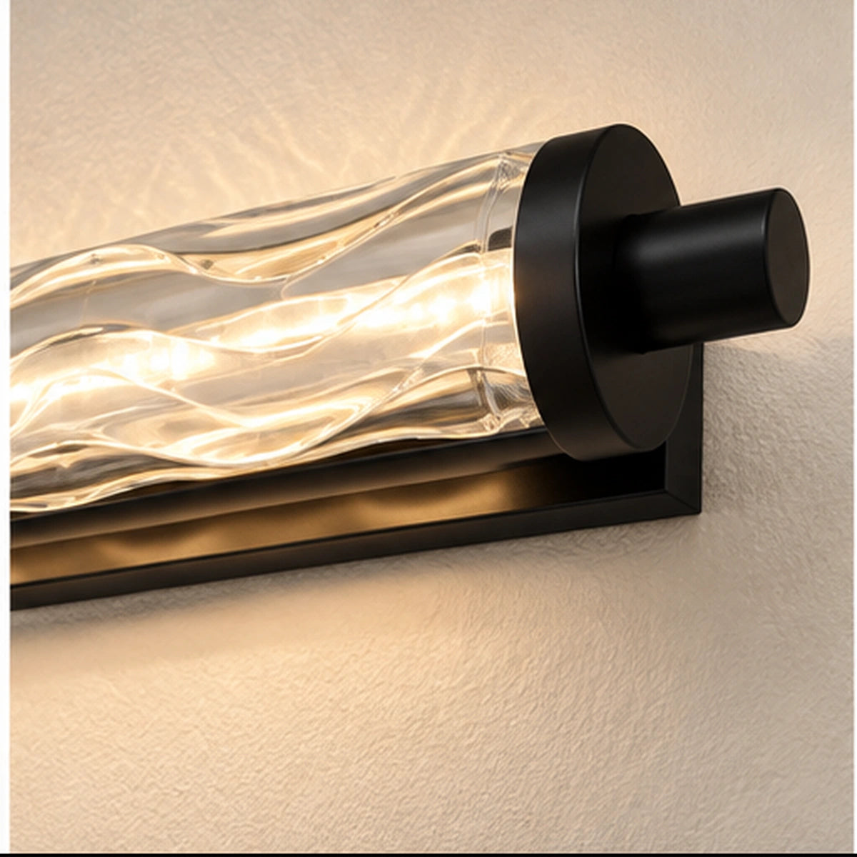 Close-up of faceted wavy glass diffuser and black end cap